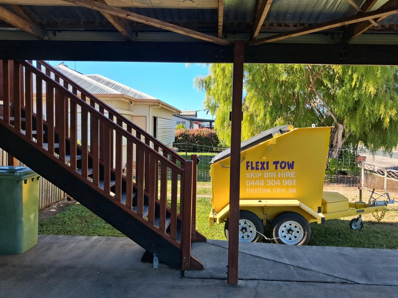 Flexi Tow trailer skip under a residential staircase